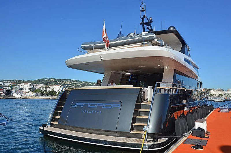 a boat docked at a pier aboard JANGADA Yacht for Sale