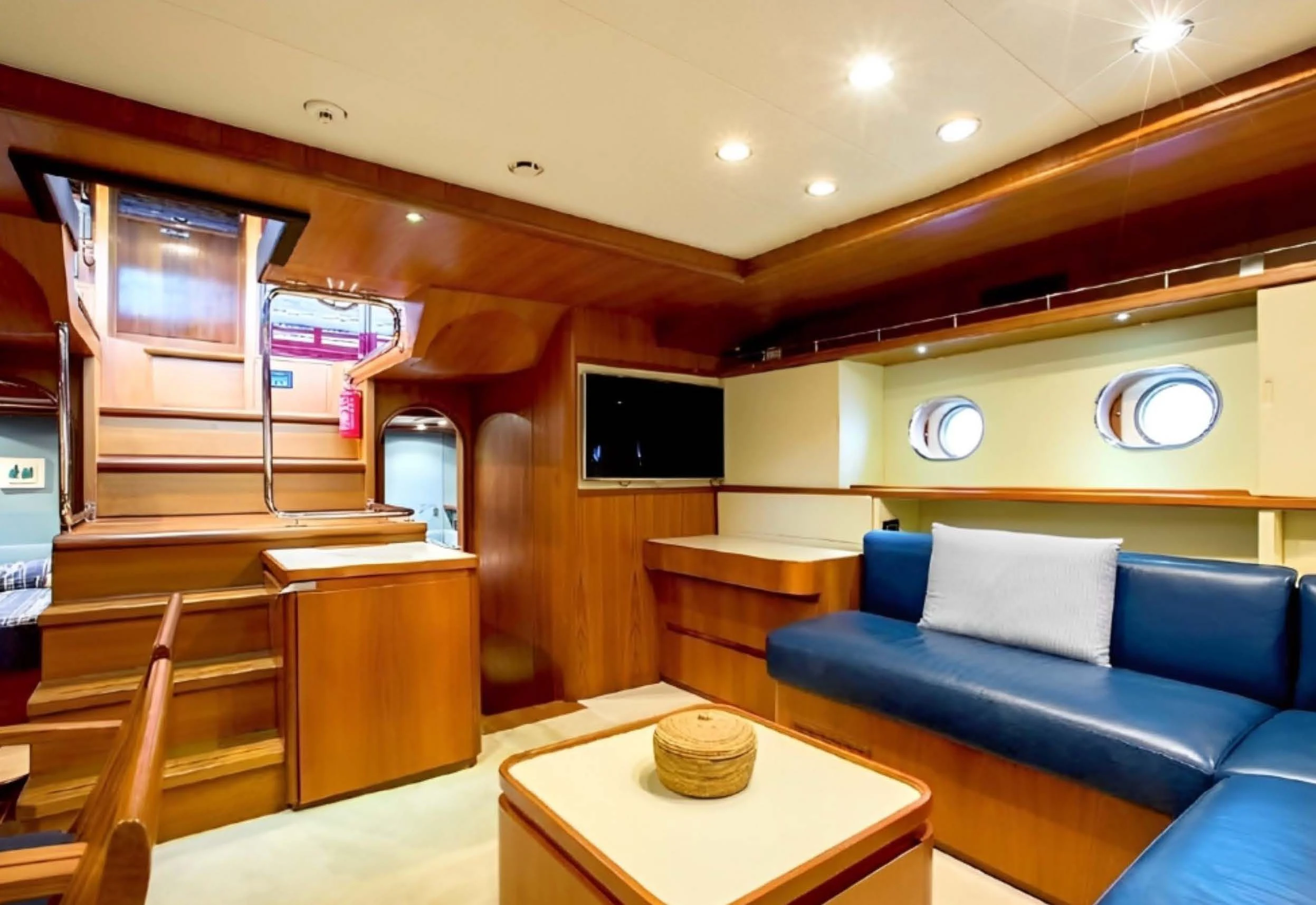 a room with a couch and a tv aboard ELETTRA Yacht for Sale