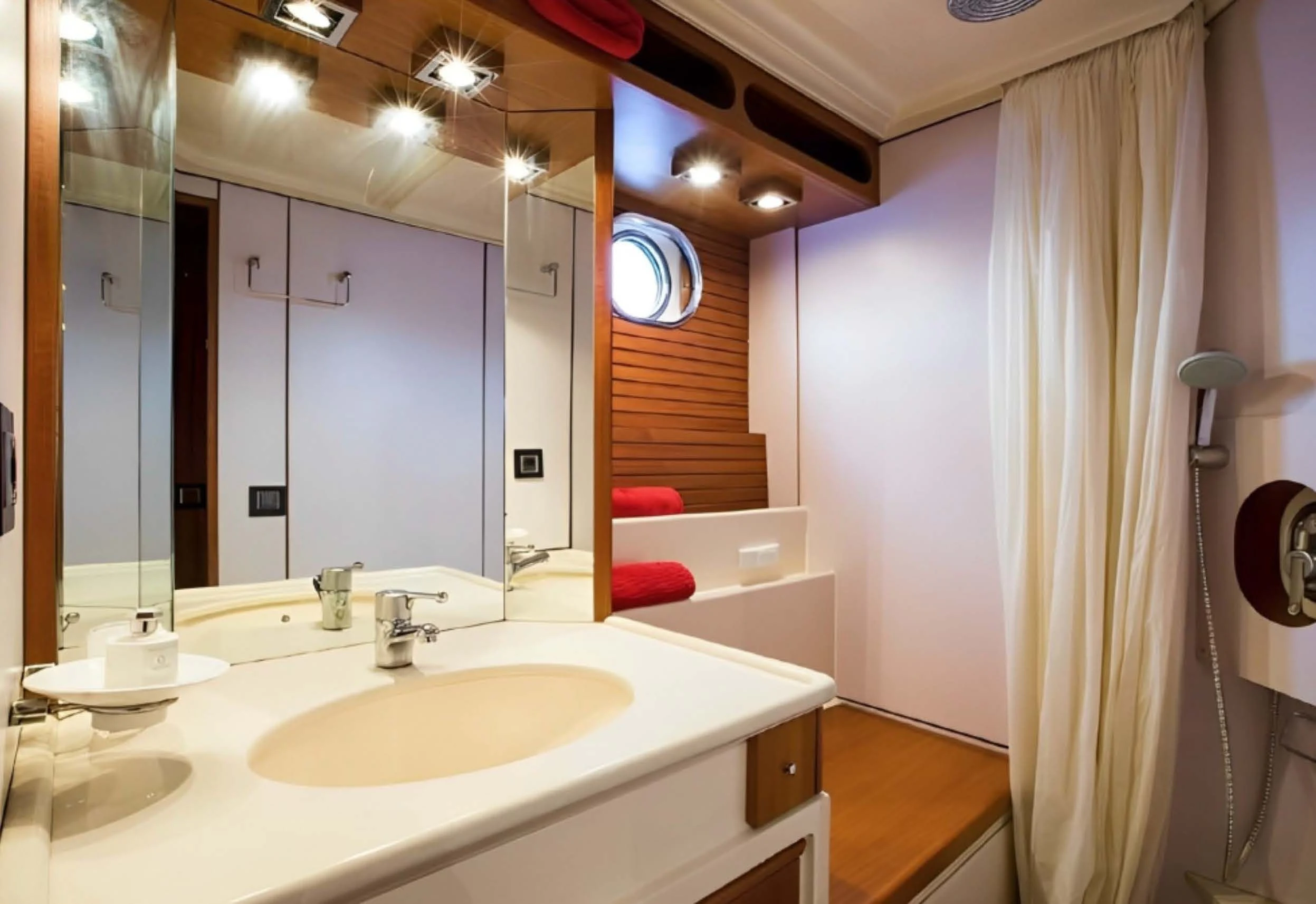a bathroom with a sink and a mirror aboard ELETTRA Yacht for Sale