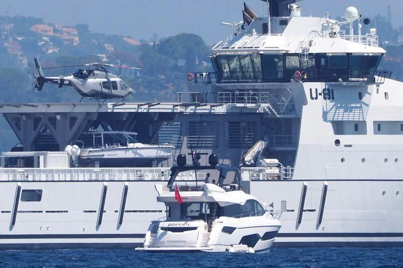 a helicopter flying over a boat aboard WINGMAN Yacht for Sale