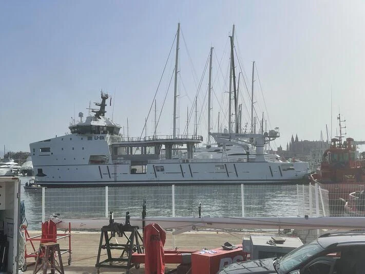 a large cruise ship docked aboard WINGMAN Yacht for Sale