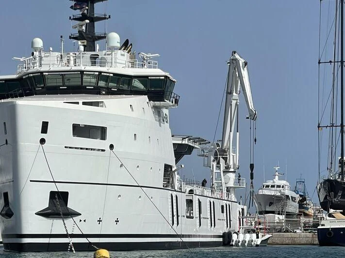 a large white boat in the water aboard WINGMAN Yacht for Sale