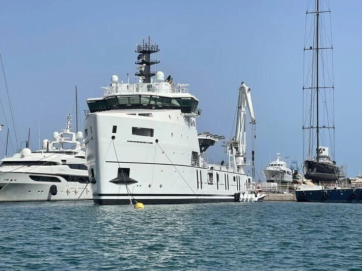 a large white boat in the water aboard WINGMAN Yacht for Sale