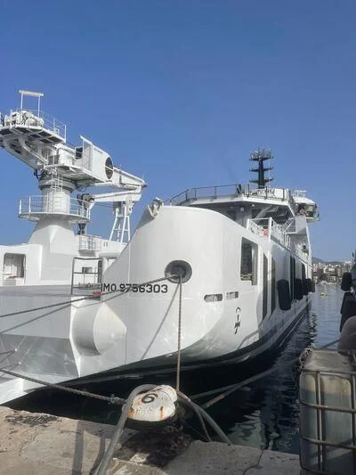 a large white ship docked aboard WINGMAN Yacht for Sale