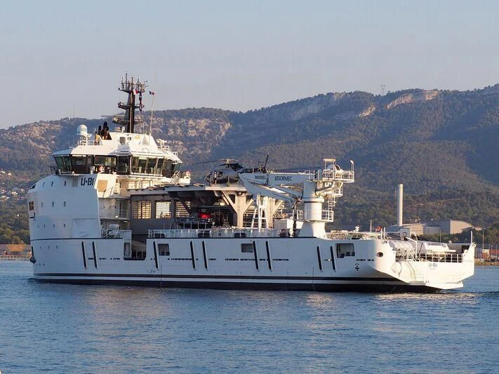 a large white ship in the water aboard WINGMAN Yacht for Sale
