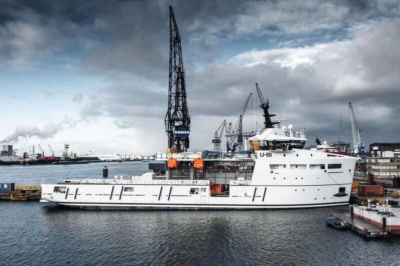 a large white ship in the water aboard WINGMAN Yacht for Sale