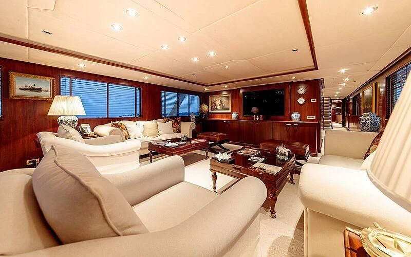 a living room with a couch and a coffee table aboard ARIONAS Yacht for Sale