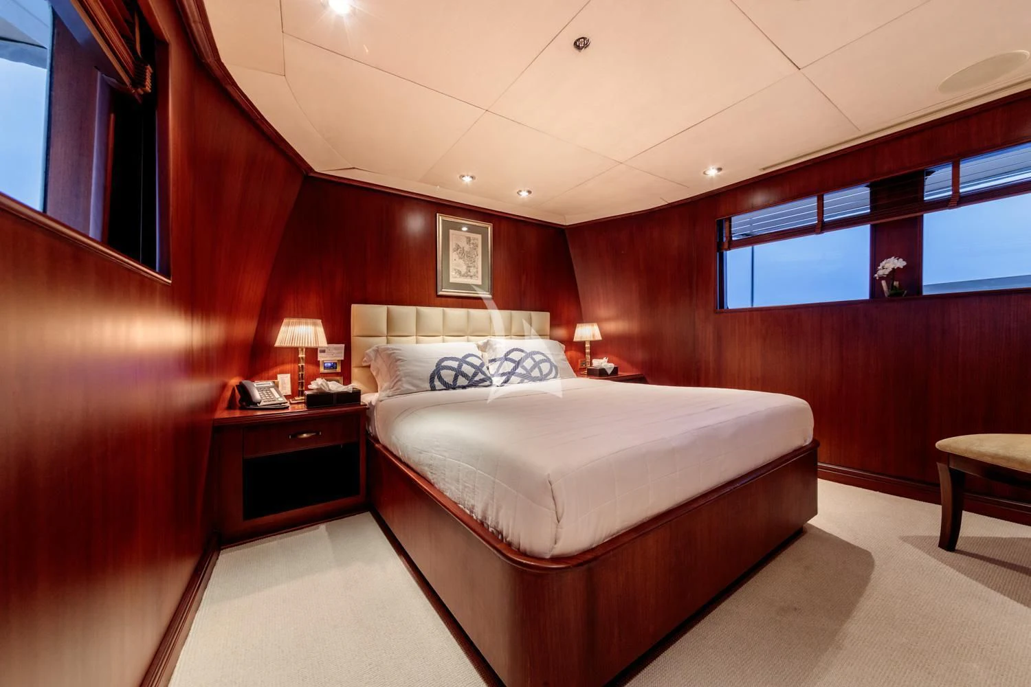 a room with a bed and a desk aboard ARIONAS Yacht for Sale