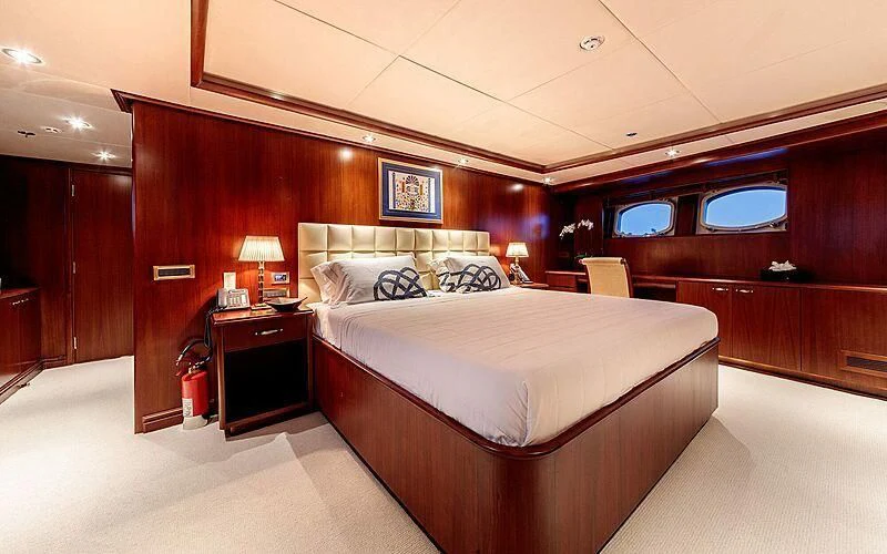 a room with a bed and a desk aboard ARIONAS Yacht for Sale