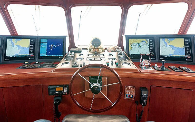 a control room with a fan and several monitors aboard ARIONAS Yacht for Sale