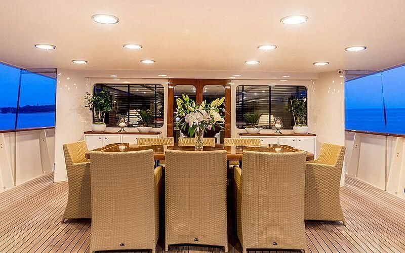 a large room with chairs and a table aboard ARIONAS Yacht for Sale