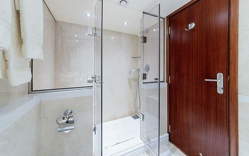 a bathroom with a glass shower aboard ARIONAS Yacht for Sale