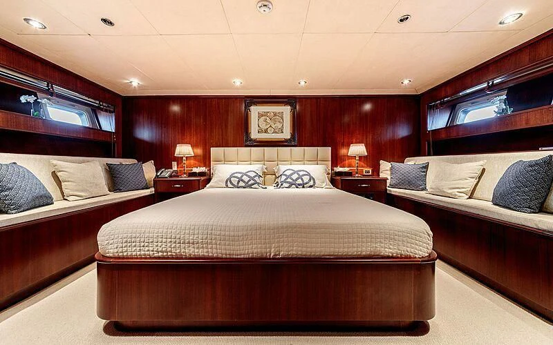 a room with a bed and a desk aboard ARIONAS Yacht for Sale