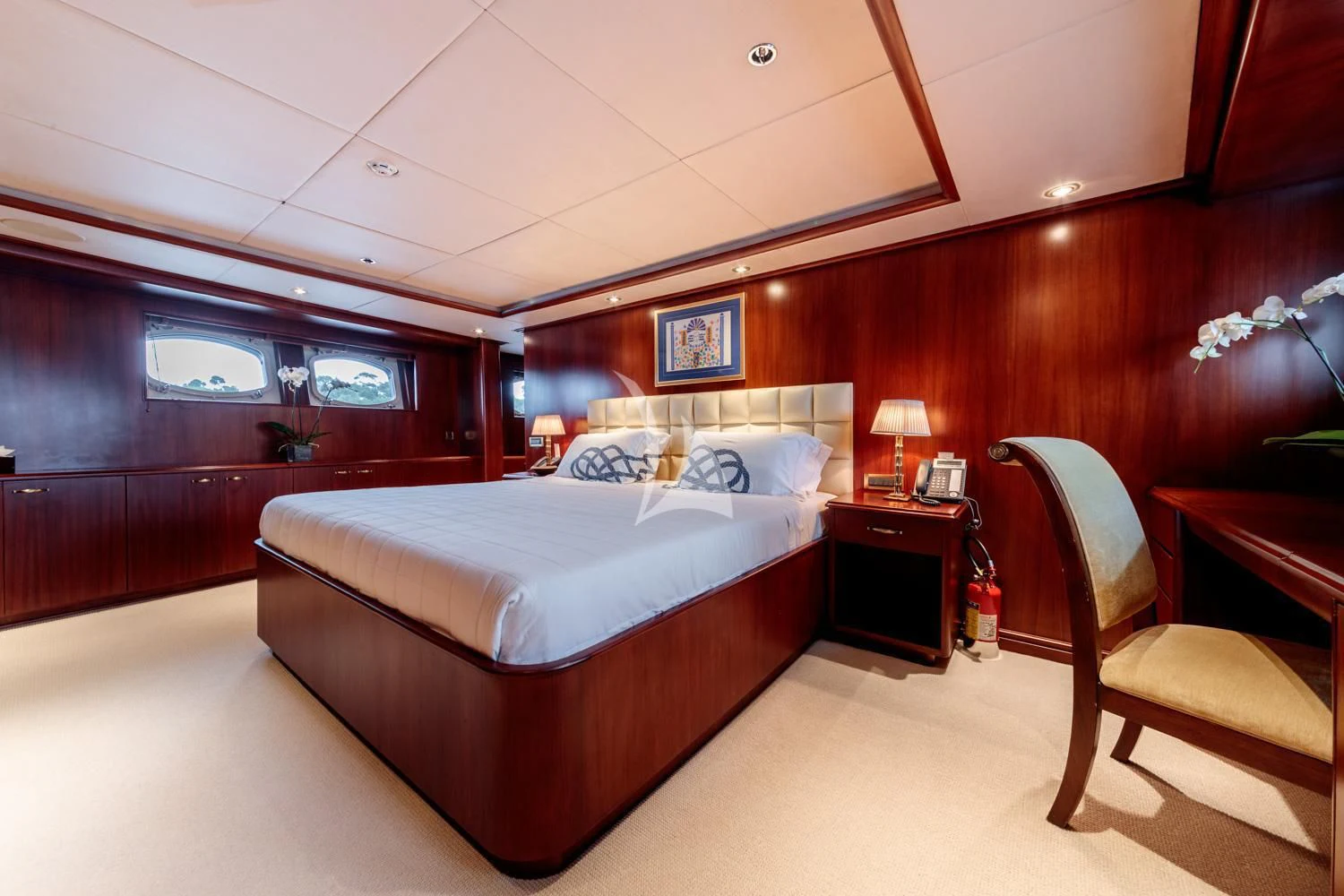 a bedroom with a bed and a desk aboard ARIONAS Yacht for Sale