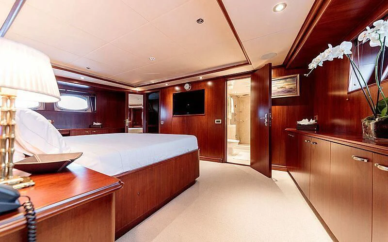 a room with a bed and a desk aboard ARIONAS Yacht for Sale