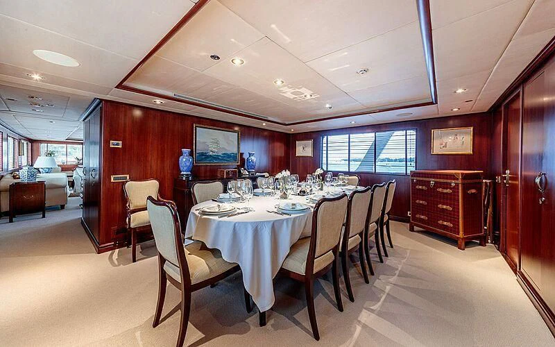 a room with tables and chairs aboard ARIONAS Yacht for Sale