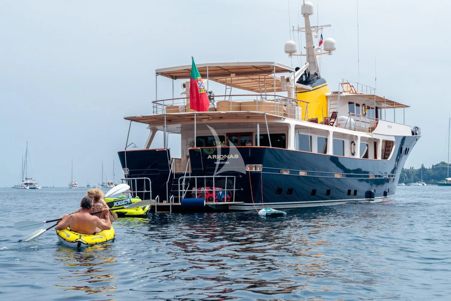 a boat with a couple of people in it aboard ARIONAS Yacht for Sale