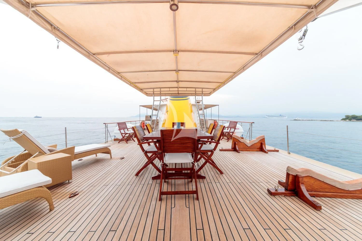 a table and chairs on a deck aboard ARIONAS Yacht for Sale