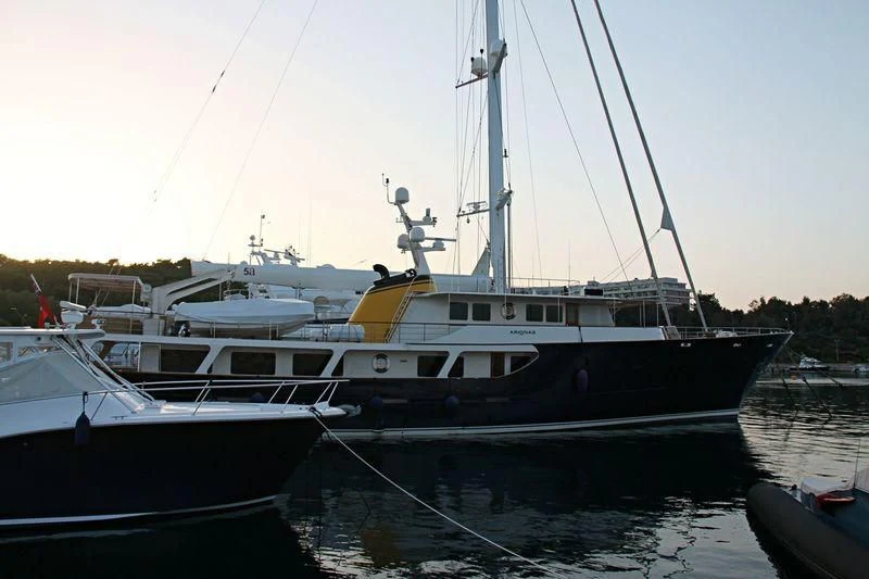 a couple of boats sit in a harbor aboard ARIONAS Yacht for Sale