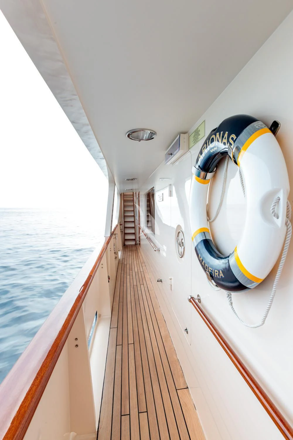 a yellow and blue speed boat on a body of water aboard ARIONAS Yacht for Sale