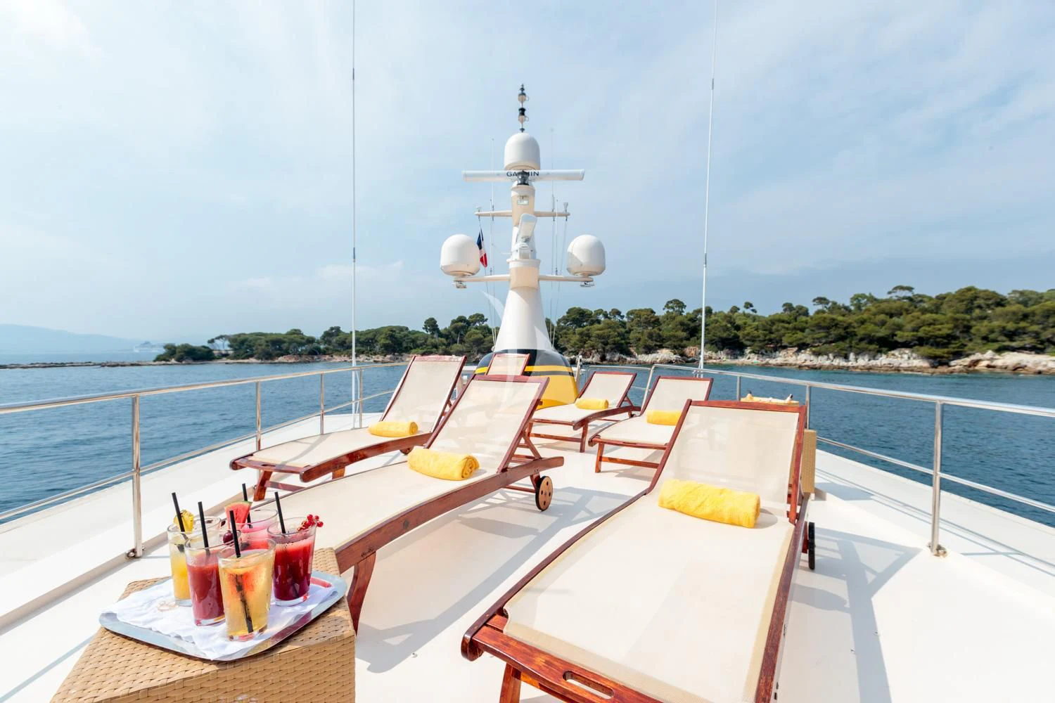 a table with drinks and a chair on it on a boat aboard ARIONAS Yacht for Sale