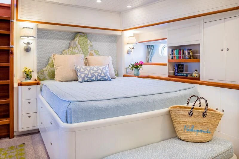 a bed with a basket on top aboard NAKUPENDA Yacht for Sale