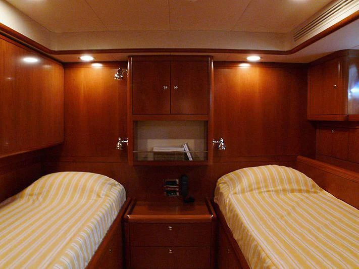 a room with wooden cabinets aboard NAKUPENDA Yacht for Sale