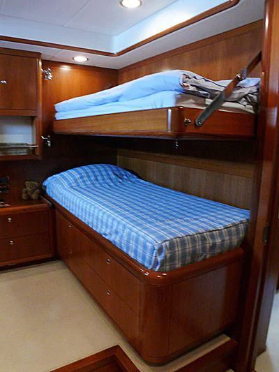 a bunk bed with a gun on top of it aboard NAKUPENDA Yacht for Sale