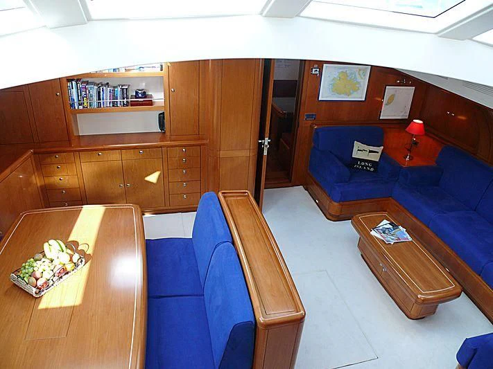 a room with a couch and a table aboard NAKUPENDA Yacht for Sale