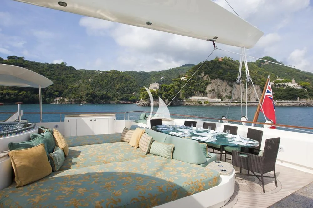 a pool with a large umbrella aboard HEMISPHERE Yacht for Sale