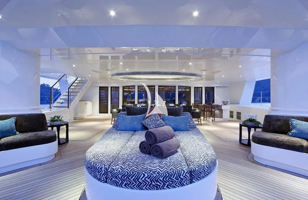 a large white room with a large bed and a large white ceiling aboard HEMISPHERE Yacht for Sale