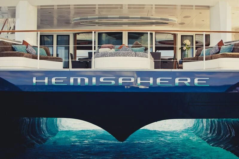 a swimming pool with people on the deck aboard HEMISPHERE Yacht for Sale