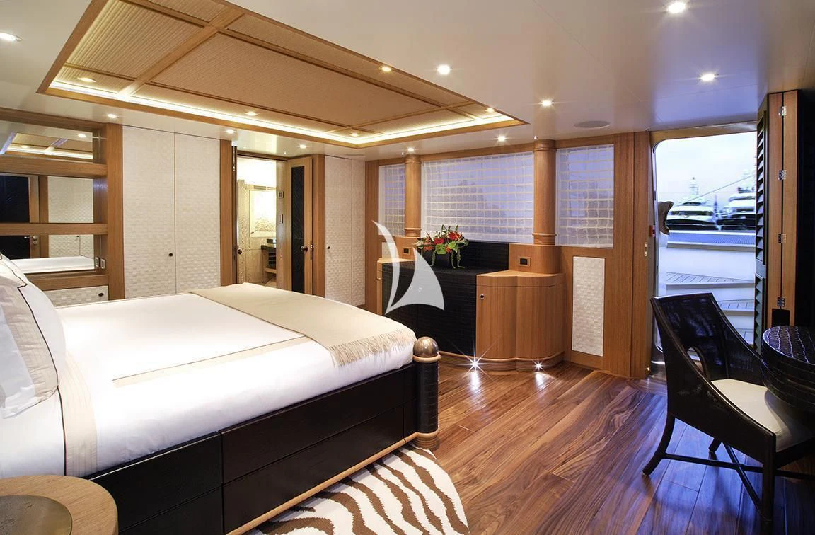 a room with a bed and a desk aboard HEMISPHERE Yacht for Sale