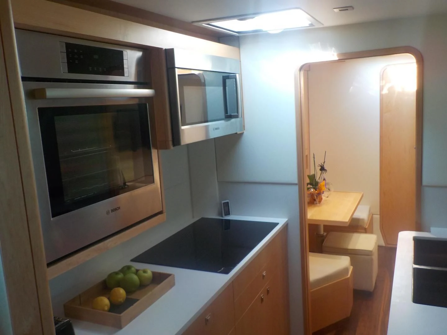 a kitchen with a microwave oven aboard MY CAT Yacht for Sale