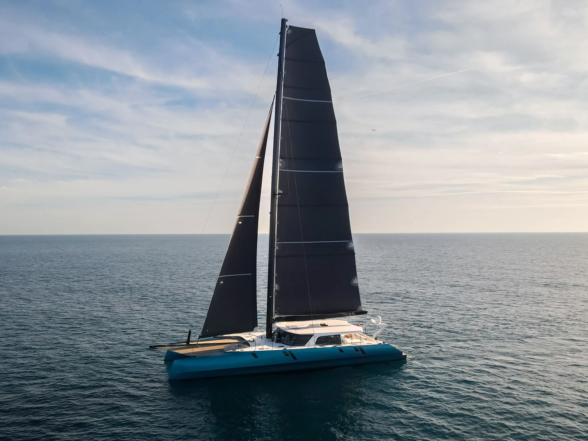 a sailboat on the water aboard MY CAT Yacht for Sale