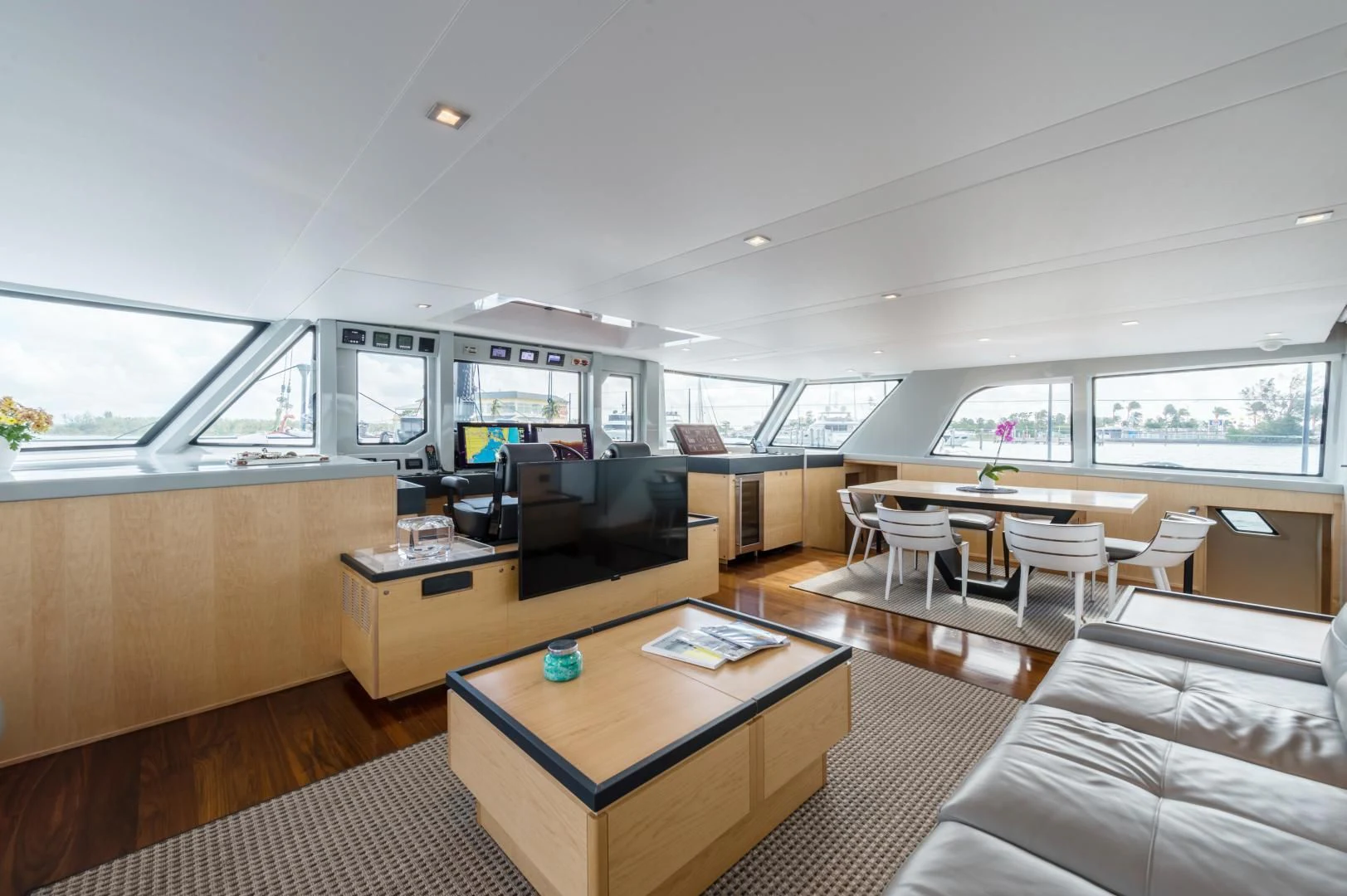 a living room with a couch and a table aboard MY CAT Yacht for Sale