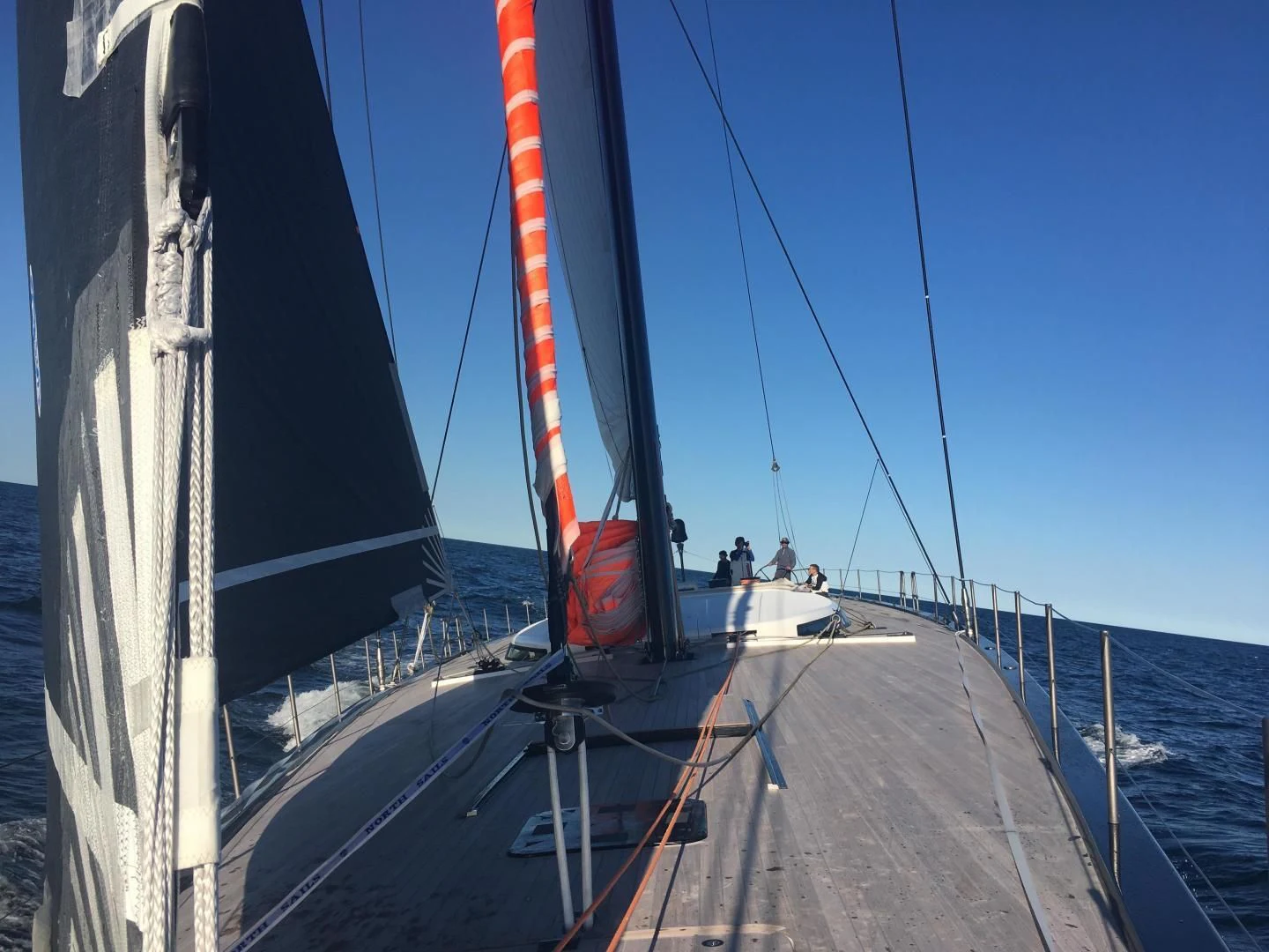 a boat with a red stripe aboard MY CAT Yacht for Sale