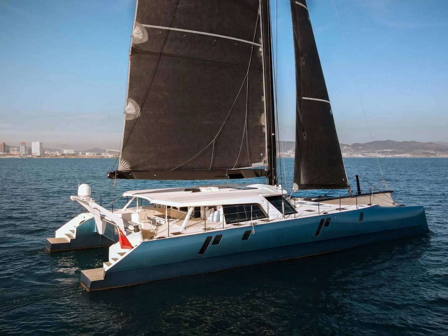 a sailboat on the water aboard MY CAT Yacht for Sale