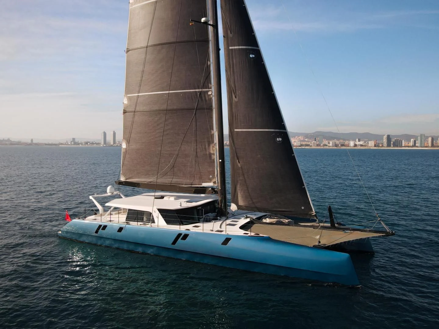 a sailboat on the water aboard MY CAT Yacht for Sale