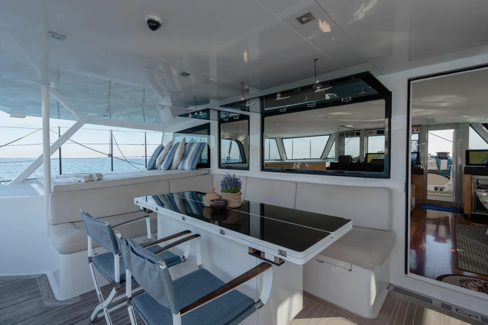 inside of a building with a table and chairs aboard MY CAT Yacht for Sale