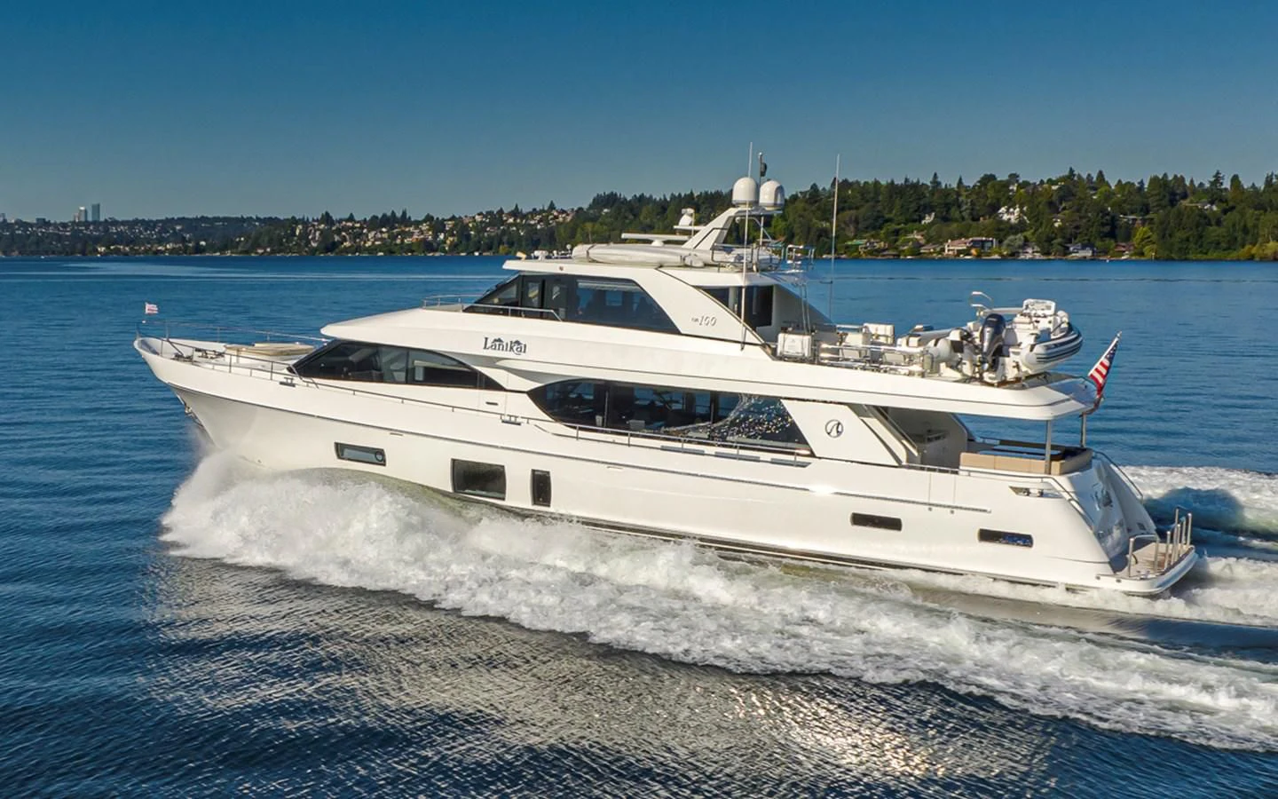 a white yacht on the water aboard HYAK Yacht for Sale