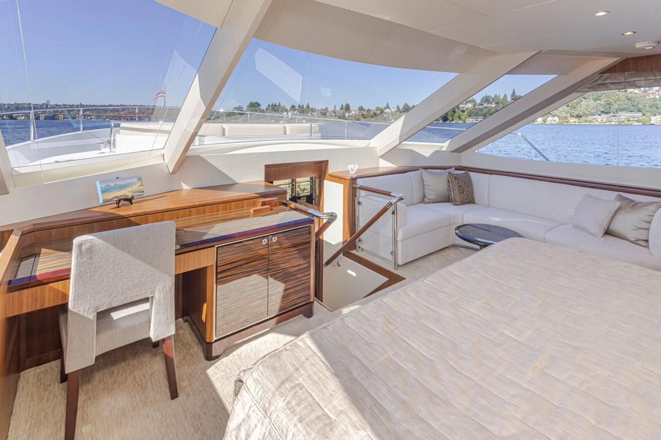 a room with a bed and a table aboard HYAK Yacht for Sale