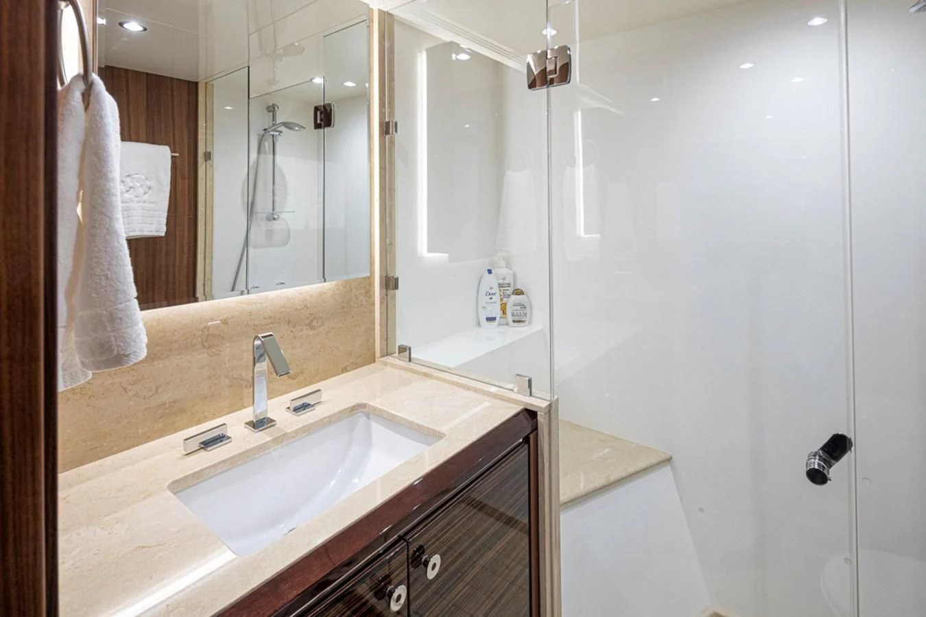 a bathroom with a sink and a mirror aboard HYAK Yacht for Sale