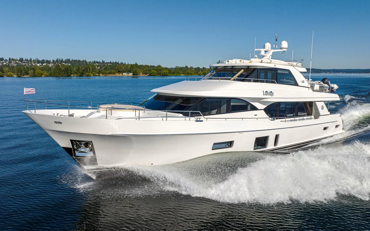 a white yacht on water aboard HYAK Yacht for Sale