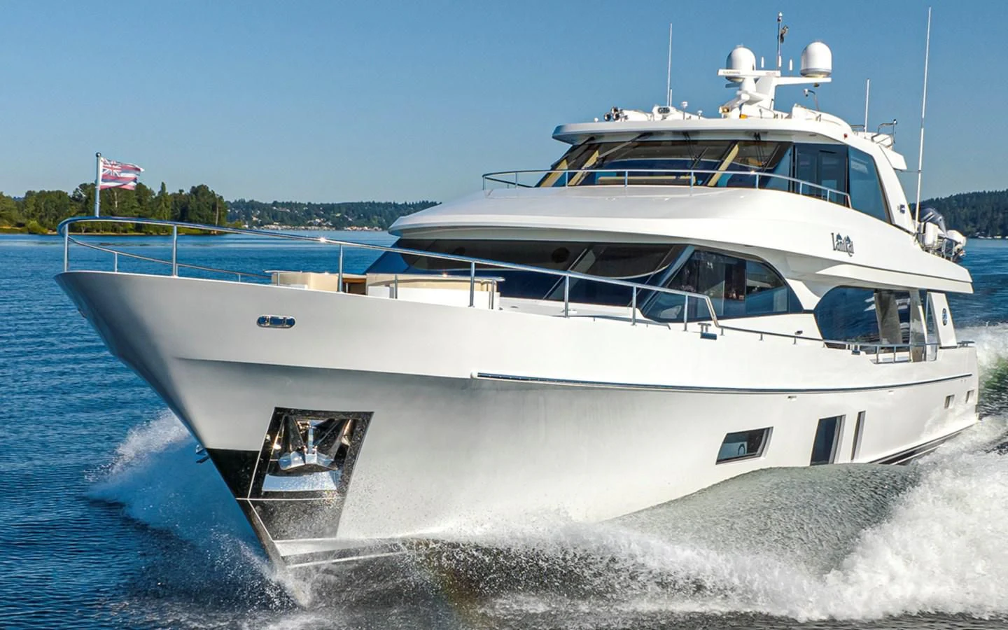 a white boat on the water aboard HYAK Yacht for Sale