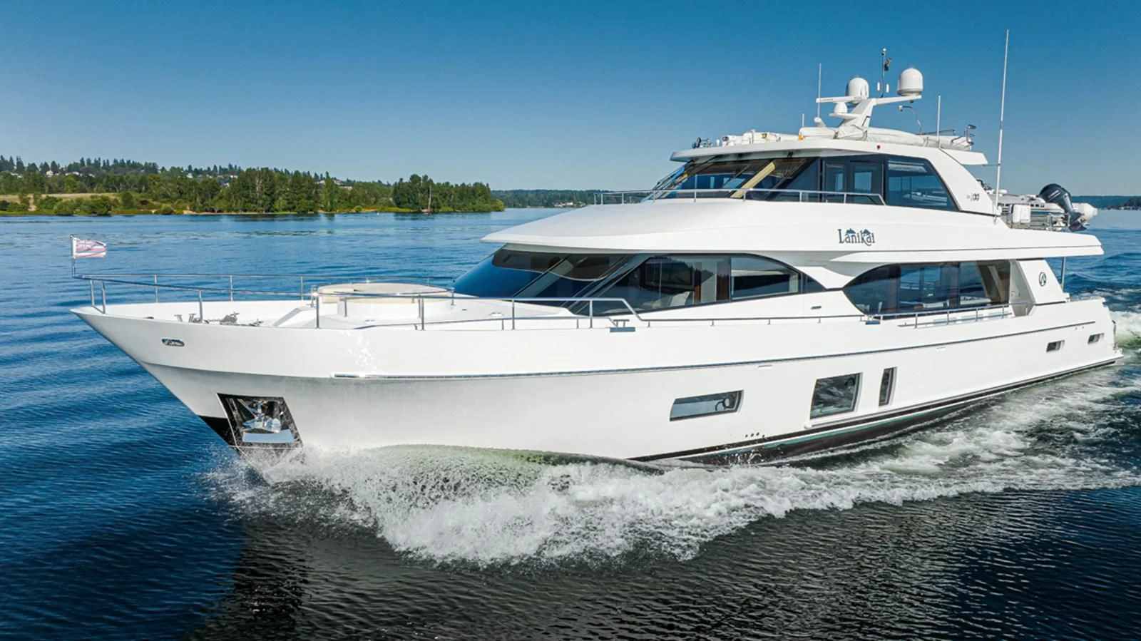 a white yacht on the water aboard HYAK Yacht for Sale