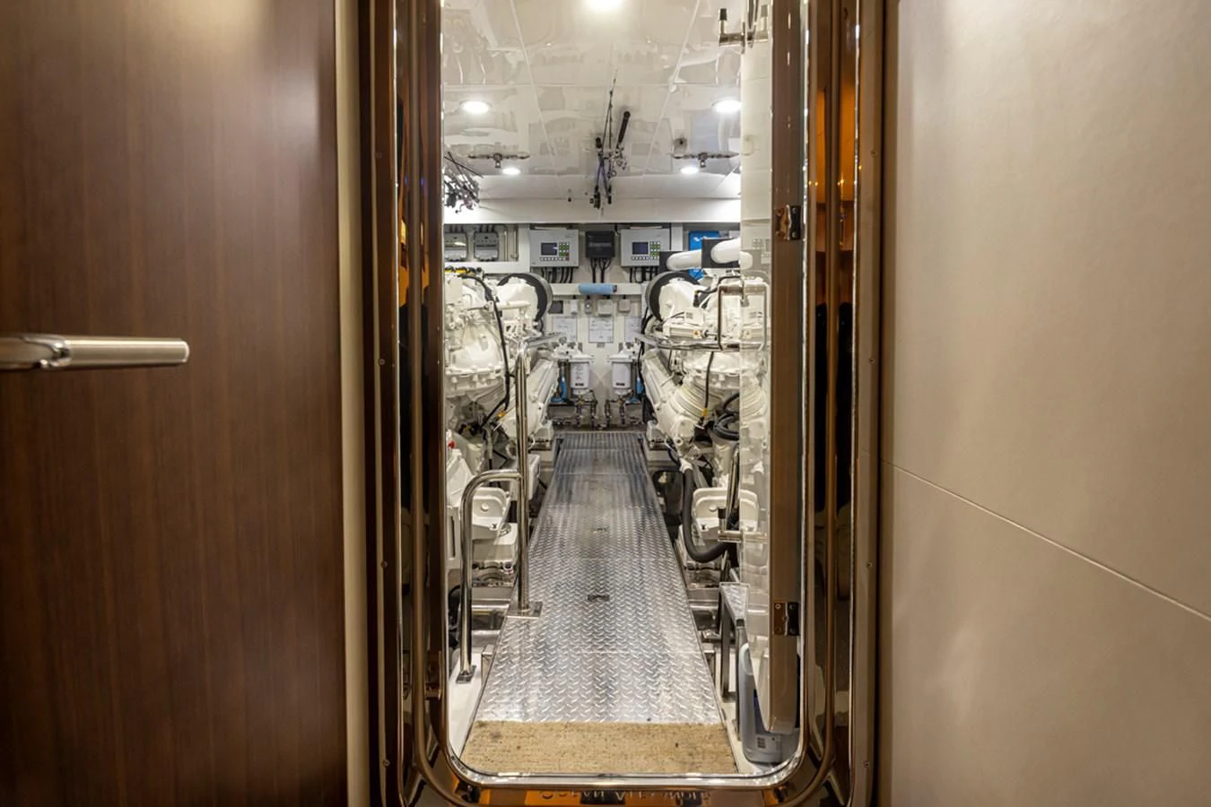 a hallway with a glass door aboard HYAK Yacht for Sale