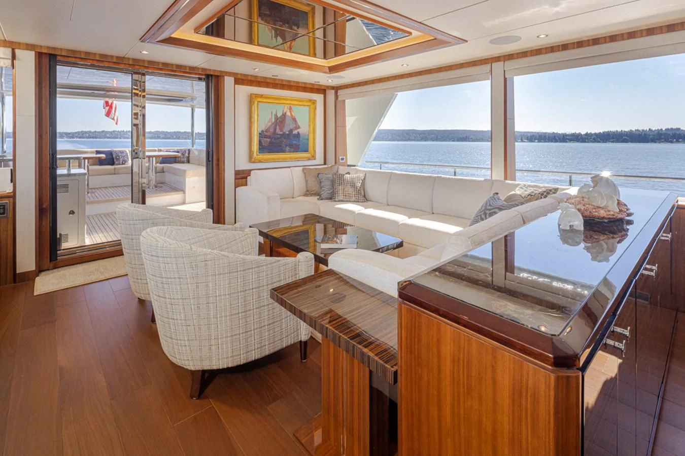 a room with a bed and a table aboard HYAK Yacht for Sale