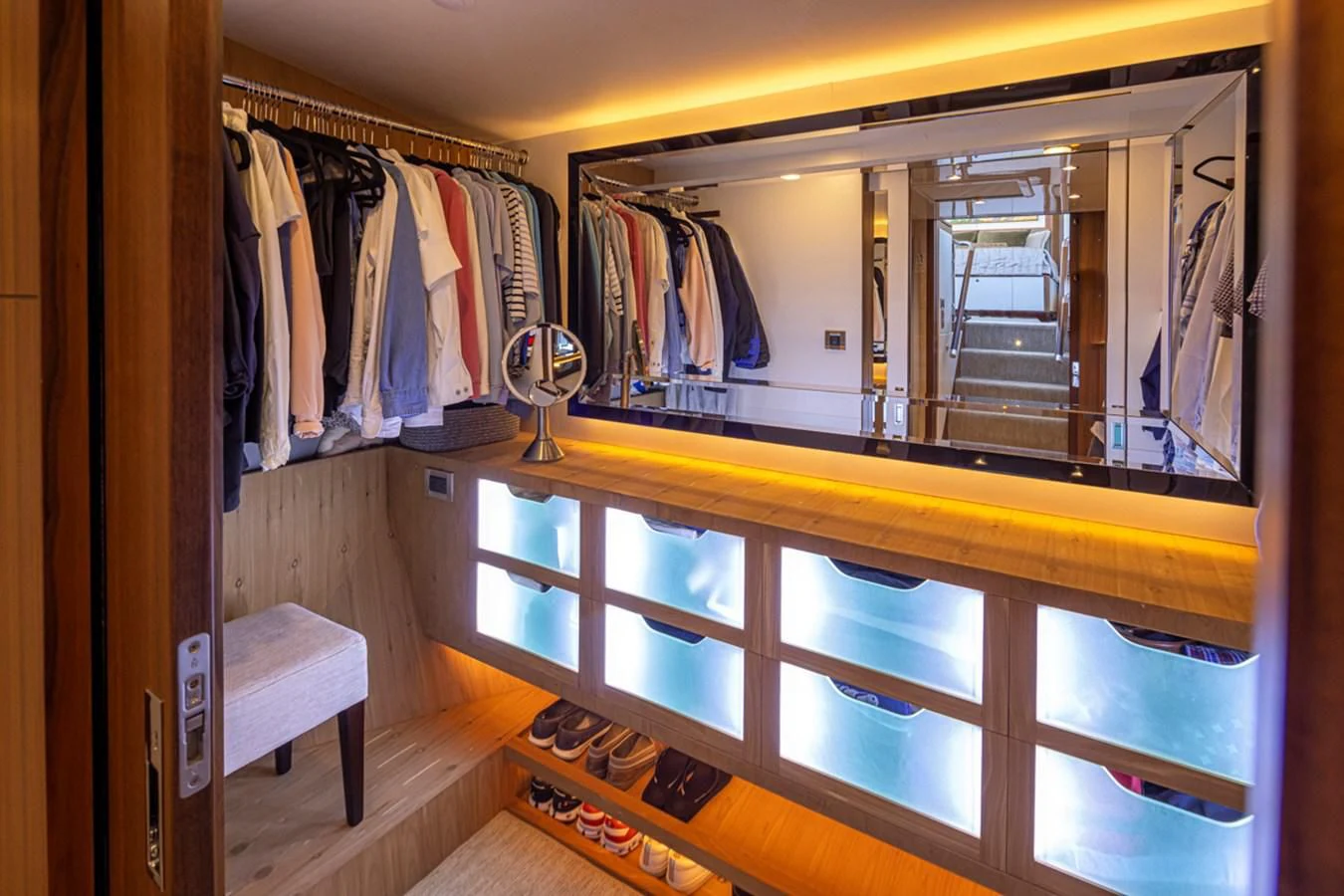 a closet with clothes on the rack aboard HYAK Yacht for Sale