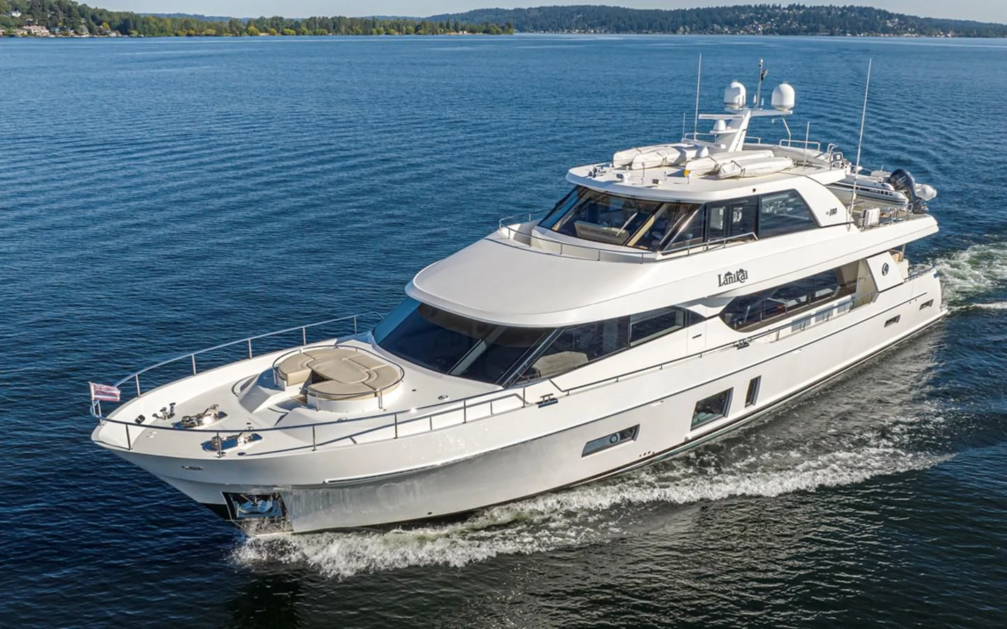 a white yacht on the water aboard HYAK Yacht for Sale